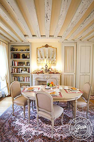 Dining area with exposed beams at Marais Elegance, apartment for rent in Paris, Marais
