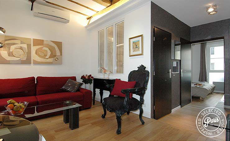 Sofa bed and armchair at Bourg Suite, vacation rental in Paris, Marais