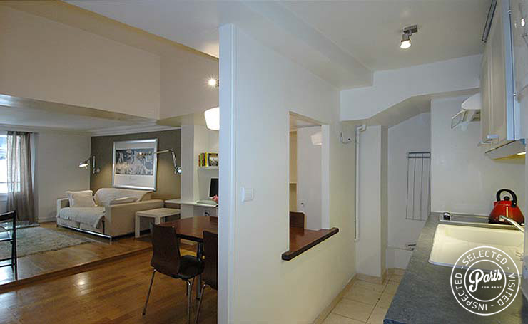 Open kitchen and living room at Place Bourg, Paris flat rental, Marais
