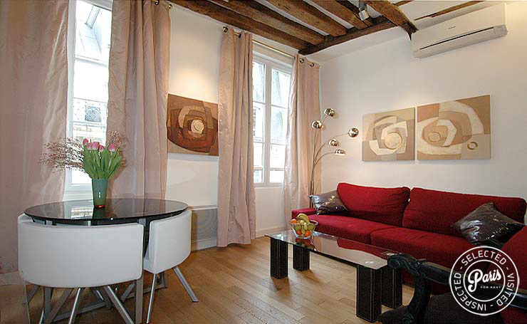 Living and dining room at Bourg Suite, apartment for rent in Paris, Marais