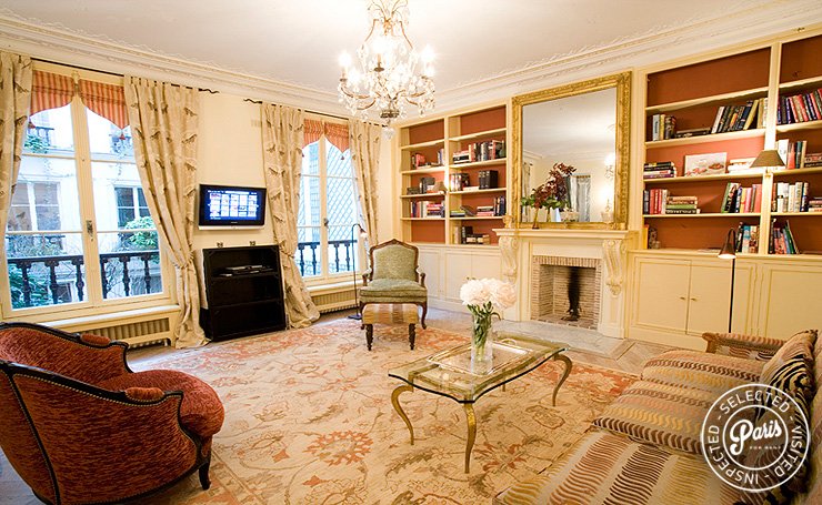 Main salon with decorative fireplace at Rive Gauche, apartment for rent in Paris, Saint Germain