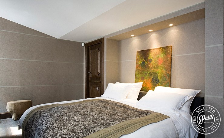 Queen-size bed in master bedroom at St Germain Eden, Paris apartment rental, Saint Germain