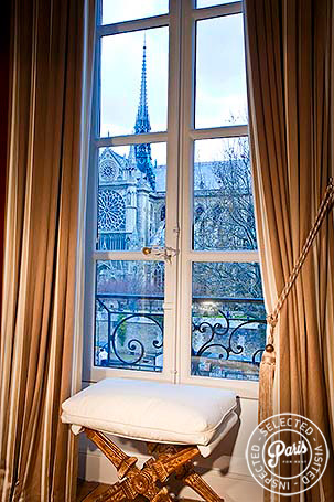 Large window with plush curtains at Notre Dame, Paris flat rental, Latin Quarter