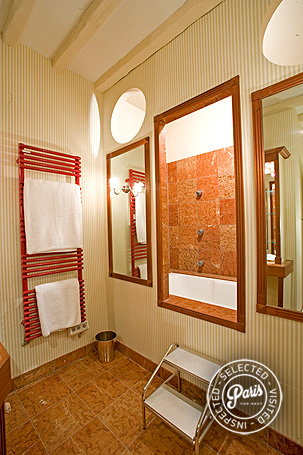 Red marble tile in bathroom at Rive Gauche, Paris apartment rental, Saint Germain