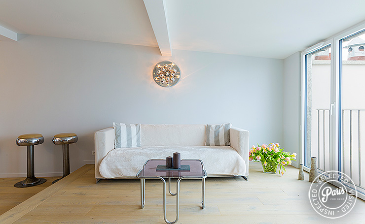 Minimalist living room at Marais Skyline, apartment for rent in Paris, Marais